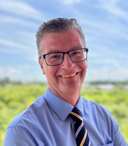 Mr. Greg Quinn OBE